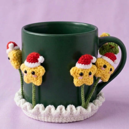 Santa hat star crochet coaster around a dark green mug