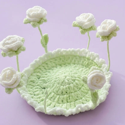 White rose pop-up crochet coaster on a mint green base