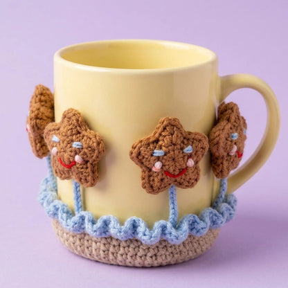 Gingerbread star crochet coaster wrapped around a yellow mug