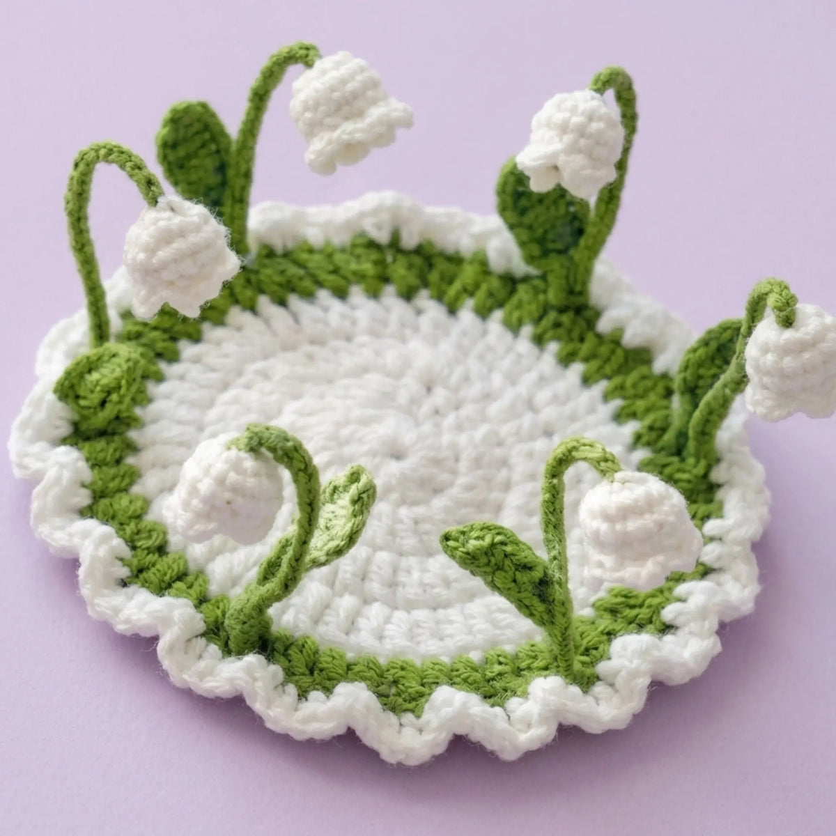Lily of the valley crochet pop-up coaster with white bell flowers