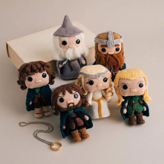 Six fantasy amigurumi crochet dolls inspired by classic adventure characters with wizard, dwarf, elves, and hobbits displayed with the One Ring