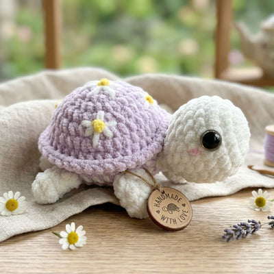 Free purple daisy turtle crochet pattern PDF with cute no-sew amigurumi design and step-by-step instructions from MrsCrochetWorld