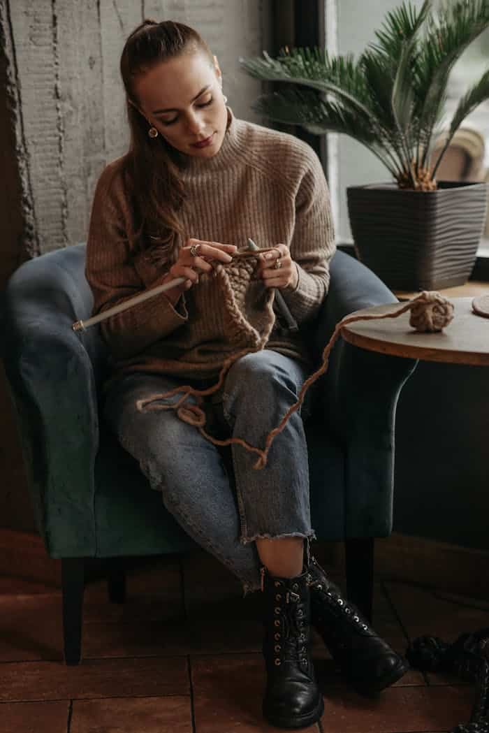 A woman sits in an armchair knitting, showcasing a relaxing indoor craft activity, crochet patterns, amigurumi crochet pattern, bunny crochet pattern, dinosaur crochet pattern, Easter crochet pattern, PDF crochet patterns, crochet plushies, beginner crochet patterns, premium crochet pattern, cute crochet animals, crochet pattern shop, amigurumi bundle, handmade crochet designs, digital crochet patterns, easy crochet tutorials, crochet toy pattern, crochet gift ideas, kawaii crochet patterns, crochet animals PDF, crochet pattern download, seasonal crochet patterns, crochet for beginners, DIY crochet patterns, crochet pattern collection, best crochet patterns 2025, crochet pattern marketplace, high quality crochet patterns, instant download crochet, soft toy crochet pattern, unique amigurumi patterns