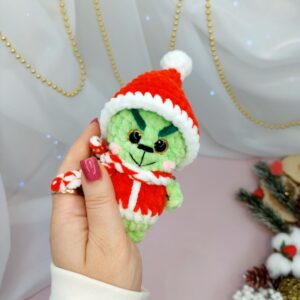Cute crochet Grinch amigurumi made with plush yarn, beginner-friendly Christmas pattern