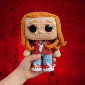 Crocheted Max character inspired by Stranger Things, handmade amigurumi doll with red hair and casual outfit, digital crochet pattern.