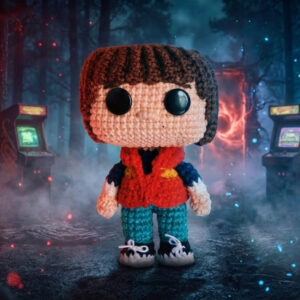Crocheted Will character inspired by Stranger Things, handmade amigurumi doll with bowl haircut and classic outfit, digital crochet pattern.