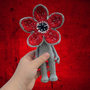 Crocheted Demogorgon character inspired by Stranger Things, handmade amigurumi monster with open flower-shaped head, digital crochet pattern.